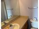 Bathroom featuring a neutral-toned vanity and a large mirror, complemented by essential fixtures at 15690 E Mexico Ave, Aurora, CO 80017