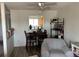 Open concept dining area featuring a view of the kitchen with wood cabinets at 15690 E Mexico Ave, Aurora, CO 80017