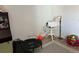 Neutral toned living room featuring a small round table with lamp, and a mini trampoline at 15690 E Mexico Ave, Aurora, CO 80017
