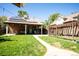 Backyard with patio, lawn, and solar panels on the house at 4322 Decatur St, Denver, CO 80211