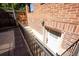 Brick stairs leading to a lower level entrance at 4322 Decatur St, Denver, CO 80211