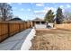 View of the detached accessory dwelling unit with a backyard and privacy fence at 104 Stuart St, Denver, CO 80219