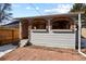 Charming exterior of an accessory dwelling unit with arched windows and a brick foundation at 104 Stuart St, Denver, CO 80219