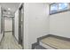 Long hallway leads to the stairwell and lower rooms at 104 Stuart St, Denver, CO 80219