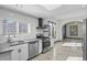 Modern kitchen showcases stainless appliances, granite counters, and white subway tile backsplash at 104 Stuart St, Denver, CO 80219