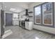 Modern kitchen with stainless steel appliances and white cabinets at 104 Stuart St, Denver, CO 80219