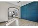 Open-concept living room with hardwood floors and an archway to the kitchen at 104 Stuart St, Denver, CO 80219