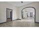 Spacious room featuring an archway and ample natural light at 104 Stuart St, Denver, CO 80219