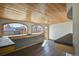 Bright sunroom with wood-paneled ceilings and arched windows, perfect for enjoying natural light and outdoor views at 104 Stuart St, Denver, CO 80219