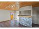 Cozy sunroom features wood paneled ceiling and a mosaic tile bar, adding warmth and character to the space at 104 Stuart St, Denver, CO 80219