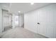 Finished basement with carpeting and white painted walls at 1673 S Fulton St, Aurora, CO 80247