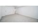 A neutral-colored carpeted bedroom with white walls and trim and a double closet at 1673 S Fulton St, Aurora, CO 80247