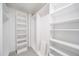 Spacious walk-in closet with custom shelving and ample storage space at 1673 S Fulton St, Aurora, CO 80247