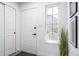 Bright foyer features neutral walls, stylish decor, and seamless flow to the living spaces at 1673 S Fulton St, Aurora, CO 80247