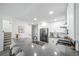 Modern kitchen boasts stainless steel appliances, ample counter space, and sleek white cabinetry at 1673 S Fulton St, Aurora, CO 80247