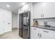 Modern kitchen featuring stainless steel appliances, white cabinets, and sleek countertops at 1673 S Fulton St, Aurora, CO 80247