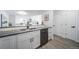 Elegant kitchen featuring stainless steel appliances, white cabinets, and minimalist hardware at 1673 S Fulton St, Aurora, CO 80247