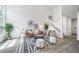 Bright living room with vaulted ceilings, ample natural light, and stylish decor with staircase to upper floor at 1673 S Fulton St, Aurora, CO 80247