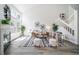 Bright living room with vaulted ceilings, fireplace, and natural light with staircase to upper floor at 1673 S Fulton St, Aurora, CO 80247