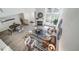 Bright living room featuring a fireplace, high ceilings, and black and white patterned rug at 1673 S Fulton St, Aurora, CO 80247