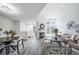 Open layout showcasing dining and living areas with large windows, fireplace, and contemporary decor at 1673 S Fulton St, Aurora, CO 80247