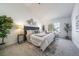 Serene bedroom featuring a comfortable bed, modern decor, large window, and ample natural light at 1673 S Fulton St, Aurora, CO 80247
