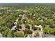 Expansive aerial view of a lush, green neighborhood with mature trees and well-maintained homes at 4121 S Cherry St, Cherry Hills Village, CO 80113