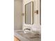 Modern bathroom featuring dual sinks, marble countertop, and brass fixtures at 4121 S Cherry St, Cherry Hills Village, CO 80113