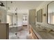 Luxurious bathroom with a soaking tub, glass shower, dual vanity, and walk-in closet at 4121 S Cherry St, Cherry Hills Village, CO 80113