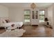 Charming bedroom featuring hardwood floors, ample natural light, and a cozy rug at 4121 S Cherry St, Cherry Hills Village, CO 80113