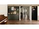 Open-concept living space featuring built-in bar, wine storage, and beautiful herringbone wood floors at 4121 S Cherry St, Cherry Hills Village, CO 80113