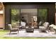 Outdoor patio with backyard view showing seating area, fire pit, and landscaping at 4121 S Cherry St, Cherry Hills Village, CO 80113
