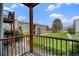 Outdoor view of a well-maintained green courtyard from a wood railed deck at 16359 W 10Th Ave # Yy3, Golden, CO 80401