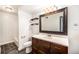 Bathroom featuring dark wood cabinets, white countertops, and shower with tub at 16359 W 10Th Ave # Yy3, Golden, CO 80401