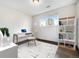 Bedroom featuring a large window, desk, shelf, and dark hardwood floors at 16359 W 10Th Ave # Yy3, Golden, CO 80401