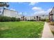 Well-manicured green lawn in front of units with gray siding at 16359 W 10Th Ave # Yy3, Golden, CO 80401