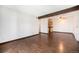 Open-concept living room features a wood beam and leads into the kitchen at 16359 W 10Th Ave # Yy3, Golden, CO 80401