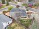 Beautiful aerial view of a charming home with mature trees, a fenced backyard, and well-maintained landscaping at 5440 W Hinsdale Ave, Littleton, CO 80128
