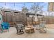 Cozy backyard patio with string lights, comfortable seating around a fire pit, and a relaxing ambiance at 5440 W Hinsdale Ave, Littleton, CO 80128