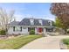 Charming single Gathering home with landscaped front yard and eye-catching red front door at 5440 W Hinsdale Ave, Littleton, CO 80128