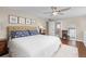 Cozy main bedroom with a plush rug, neutral walls, and great natural light at 5440 W Hinsdale Ave, Littleton, CO 80128