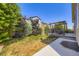 Large backyard area features patio, grass, privacy fence and mature trees at 6863 E 132Nd Pl, Thornton, CO 80602