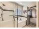 Modern bathroom featuring a tiled shower, soaking tub, and stylish accents at 6863 E 132Nd Pl, Thornton, CO 80602