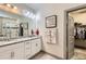 Bright bathroom with a granite countertop, vanity, and walk-in shower in the background at 6863 E 132Nd Pl, Thornton, CO 80602