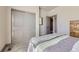 Well-lit bedroom with a sliding closet and neutral walls at 6863 E 132Nd Pl, Thornton, CO 80602