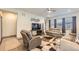 Comfortable living room with neutral walls, modern decor, and stylish seating arrangements at 6863 E 132Nd Pl, Thornton, CO 80602