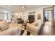 Bright living area with a contemporary rug, modern decor, and comfortable leather seating at 6863 E 132Nd Pl, Thornton, CO 80602