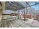 Inviting backyard patio with a pergola, table and chairs for outdoor relaxation and entertaining at 4257 Graham Ct, Boulder, CO 80305