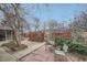 Backyard patio area with mature trees and a privacy fence at 4257 Graham Ct, Boulder, CO 80305