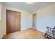 Cozy bedroom with hardwood floors and a closet with standard wood panel doors at 4257 Graham Ct, Boulder, CO 80305